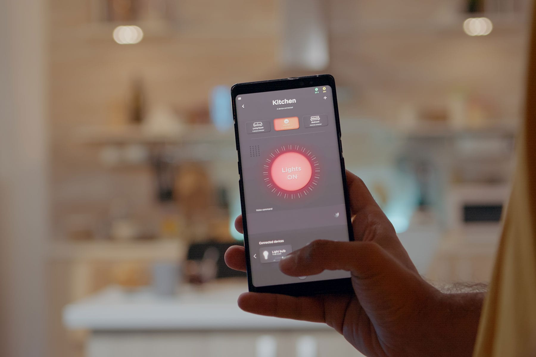 young man using smart home application software touching screen turn light by mobile phone